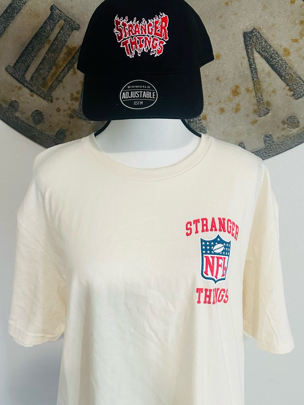 Stranger Things NFL Cream Graphic Tee with Black Stranger Things Hat